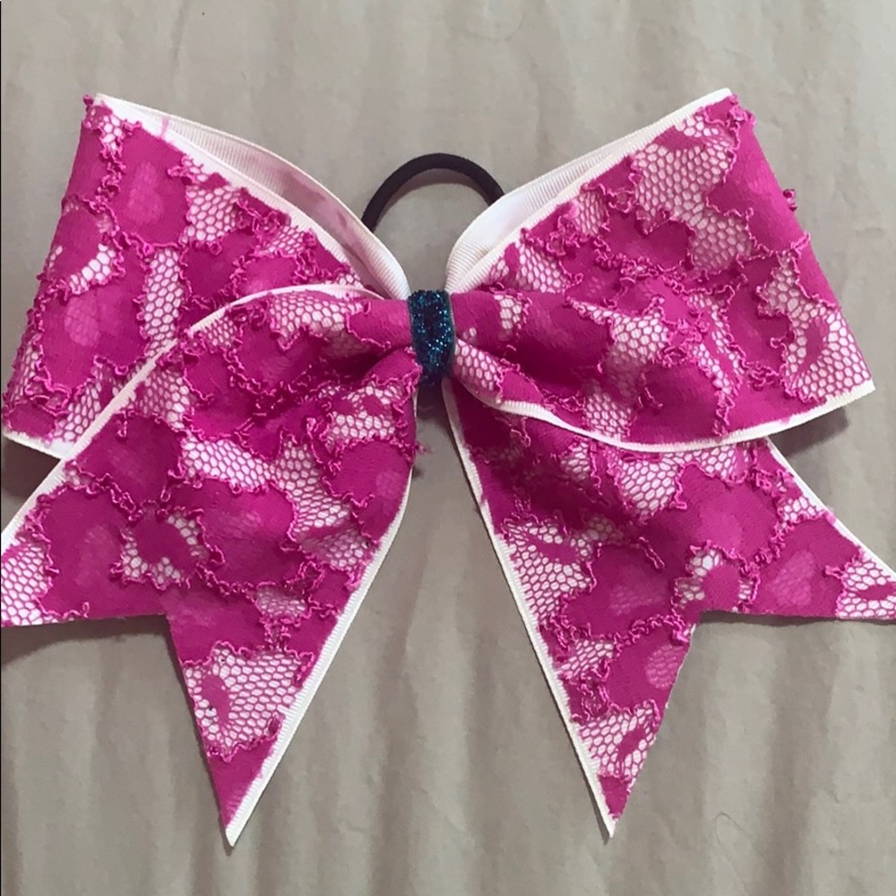 Pink lace cheer bow with blue middle